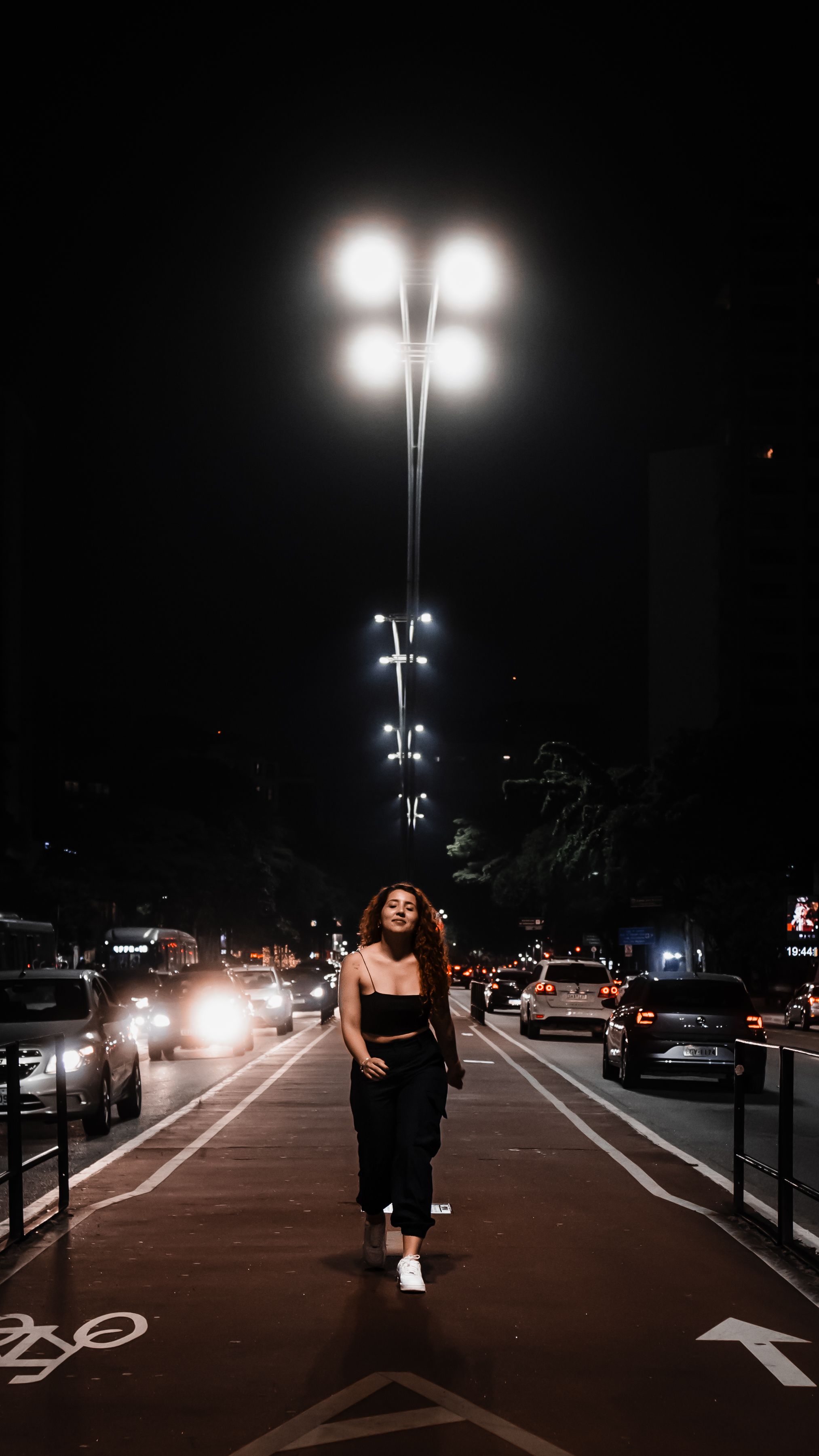 Portrait of a Stylish Young Woman Walking on a Bike Lane at Night ...