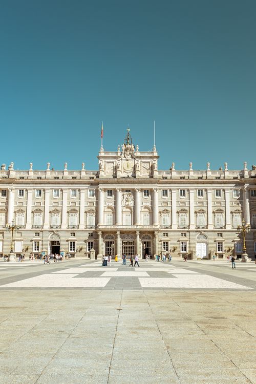 Free Vertical shot of the Royal Palace in Madrid, showcasing its architecture under clear skies. Stock Photo