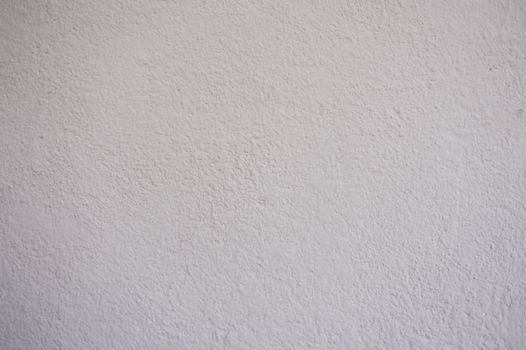 Close-up of a textured white wall, ideal for background or copyspace use.