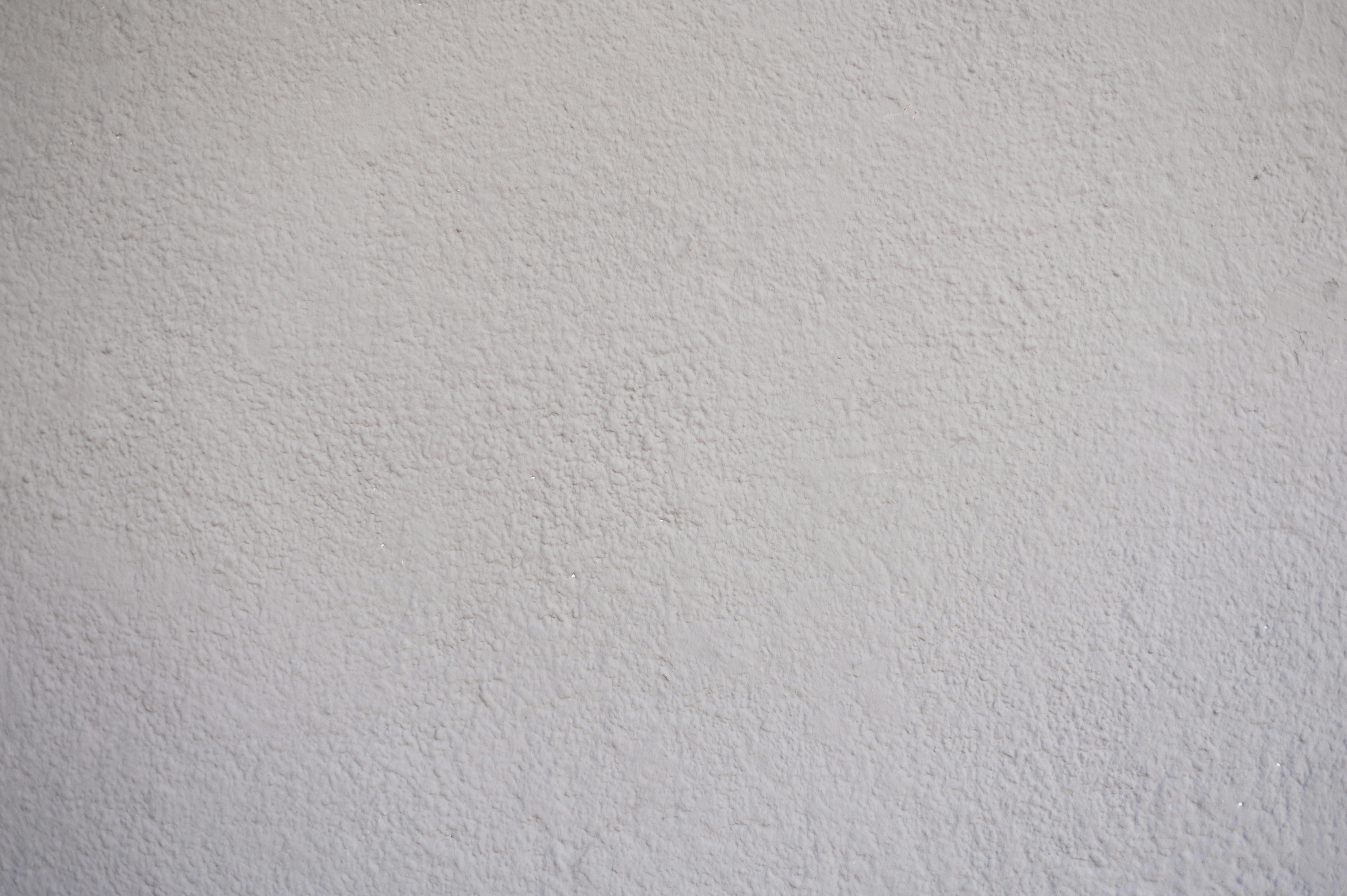 Free Close-up of a textured white wall, ideal for background or copyspace use. Stock Photo