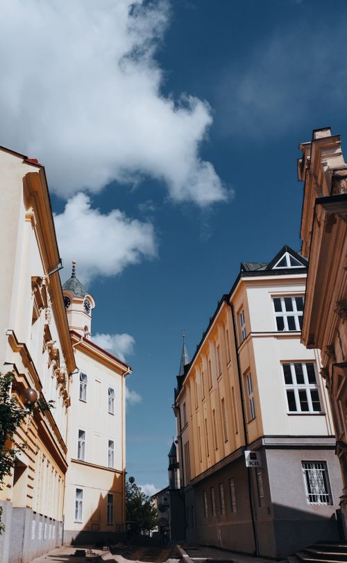 Free Charming European architecture under a bright blue sky, reflecting historical elegance. Stock Photo
