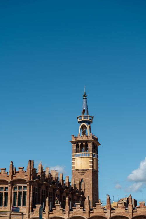Free A stunning view of the iconic Fabrica Casaramona tower in Barcelona under a clear blue sky. Stock Photo