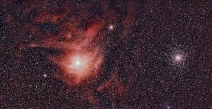 A stunning view of a nebula and star cluster in deep space, showcasing cosmic beauty.