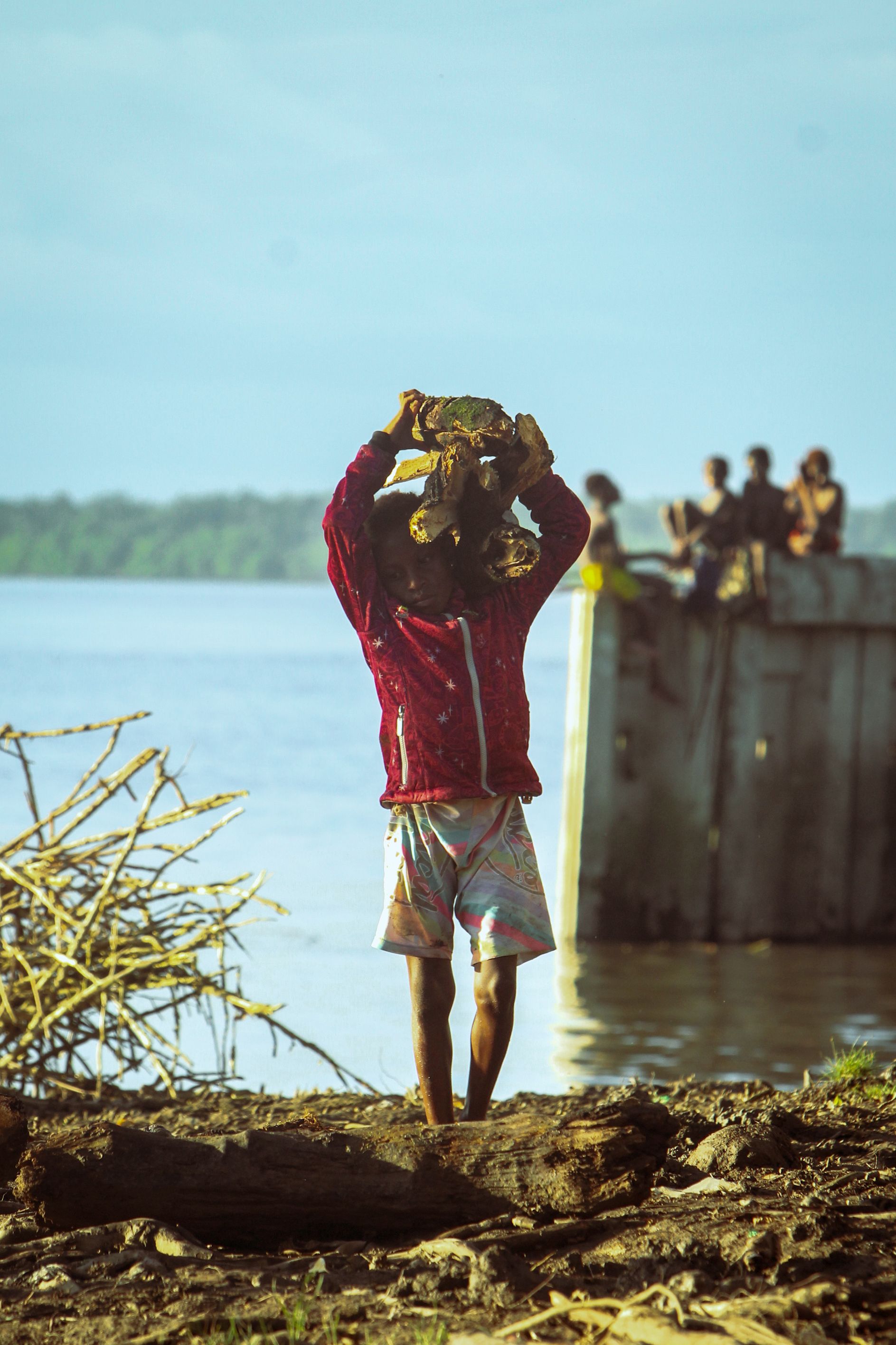 Man Carrying Stones From the River · Free Stock Photo