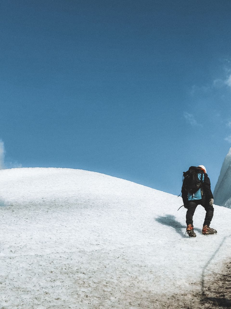 Photo by Marina Zvada on Pexels — a climber crossing a glacier