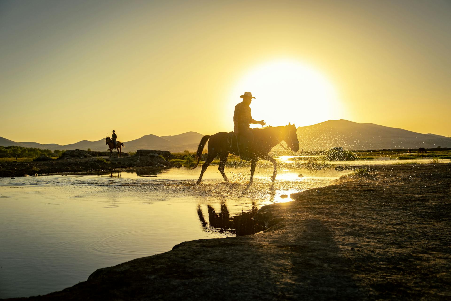 Cowboy in Countryside at Sunset