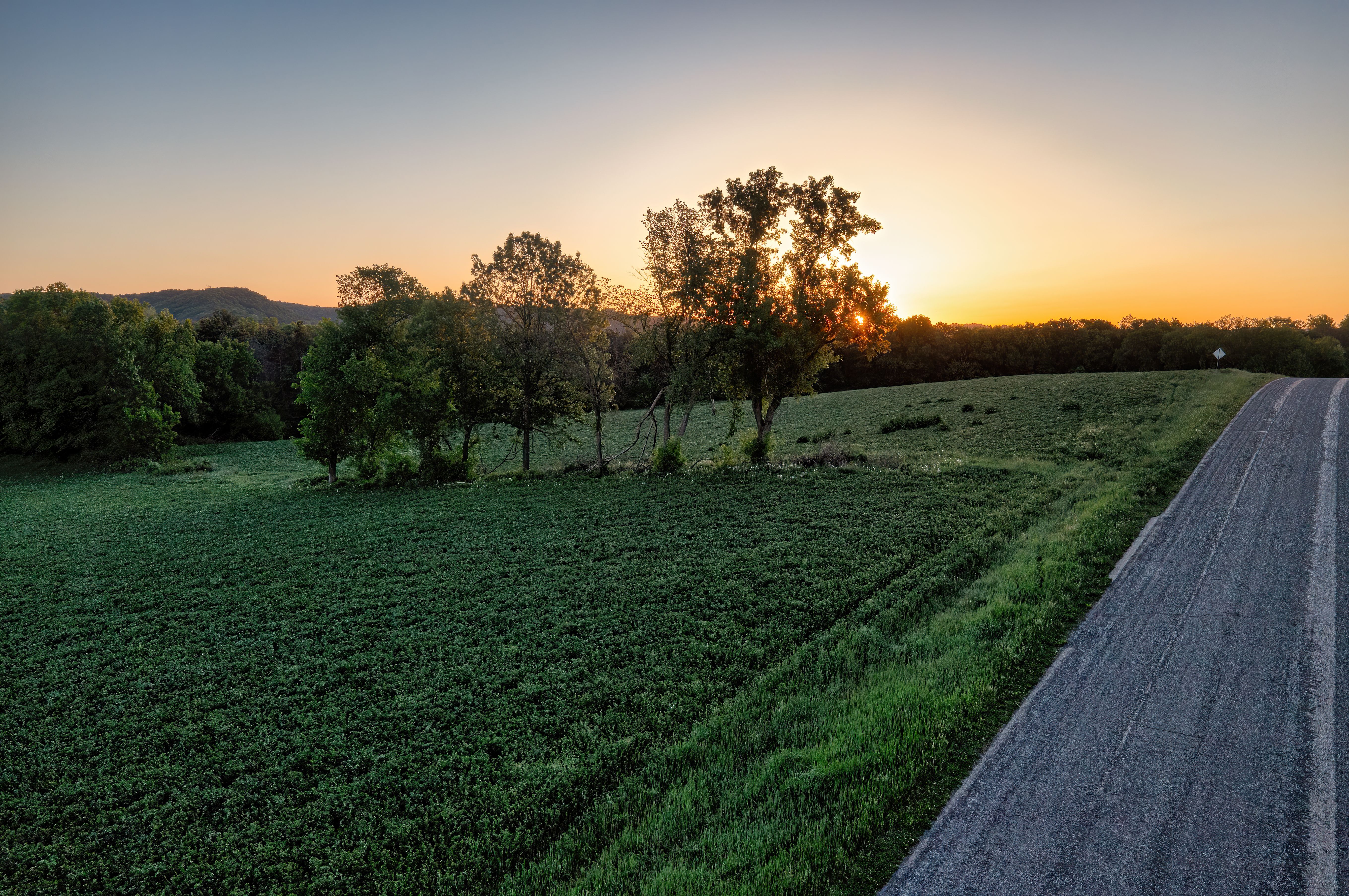 Breathtaking sunset over a rural road and countryside in Misha Mokwa, WI, USA.
