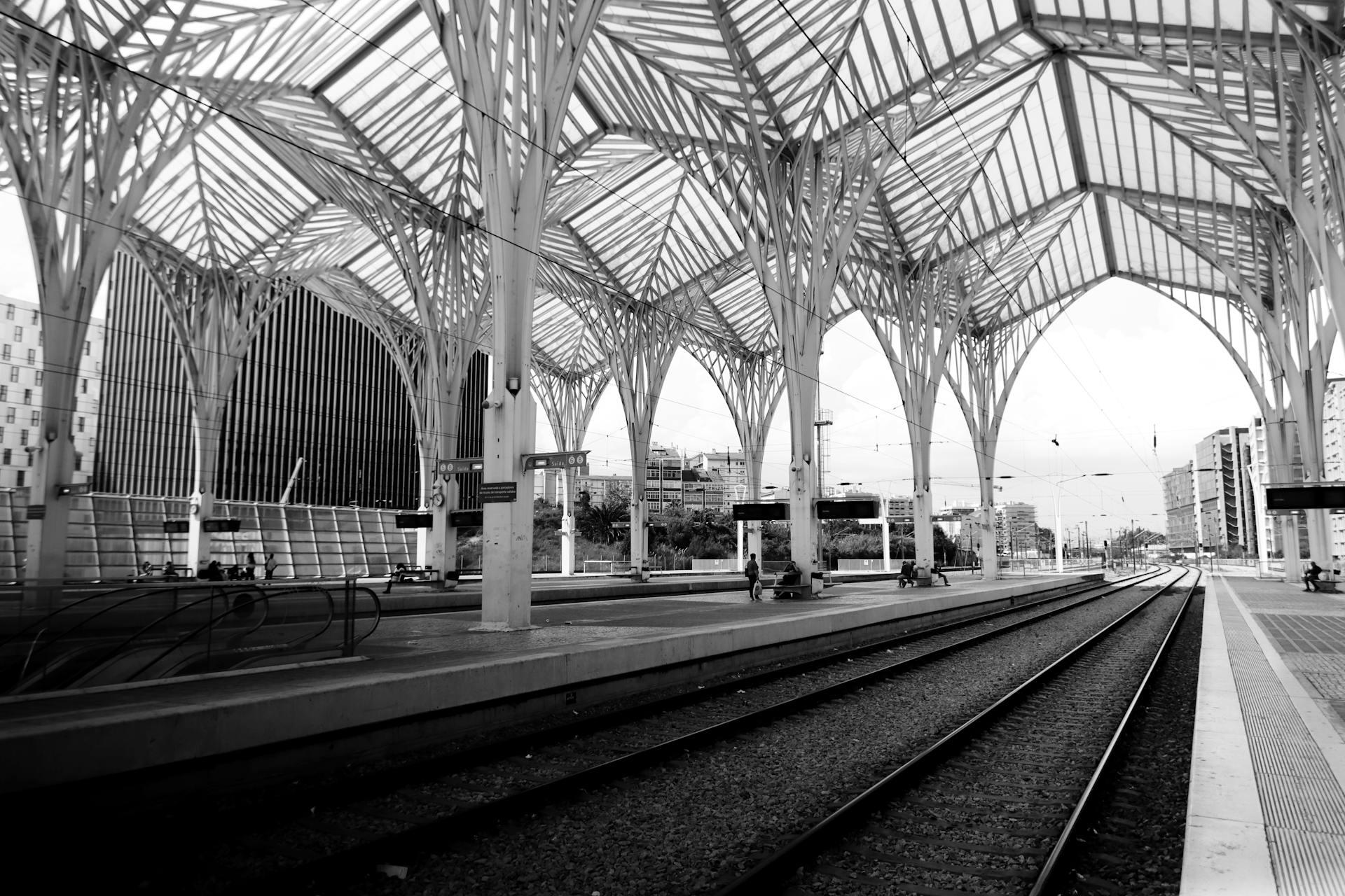Dramatic black and white photo of Lisbon's modern train station architecture.