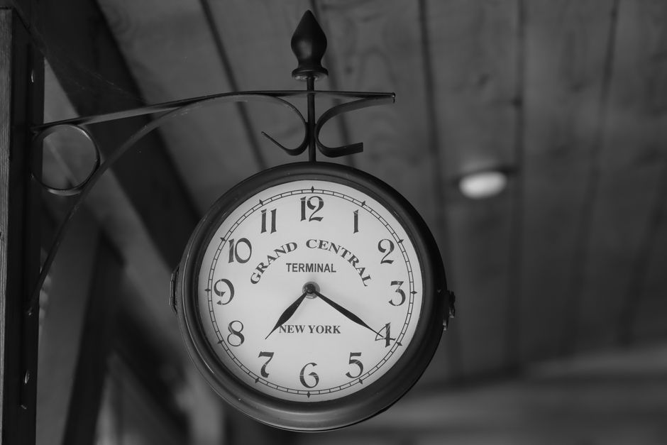 Classic Grand Central Terminal clock in black and white, showcasing vintage charm indoors.
