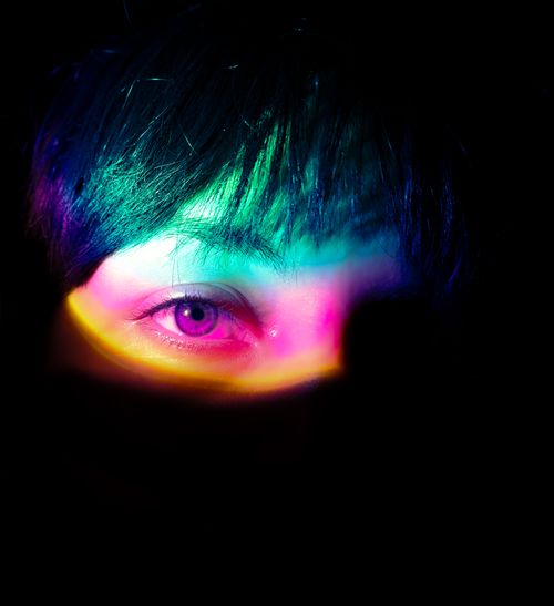 Free Vibrant close-up of an eye with rainbow colors, creating a surreal and artistic effect. Stock Photo