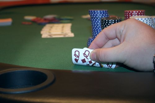 Free Pocket queens poker hand Stock Photo