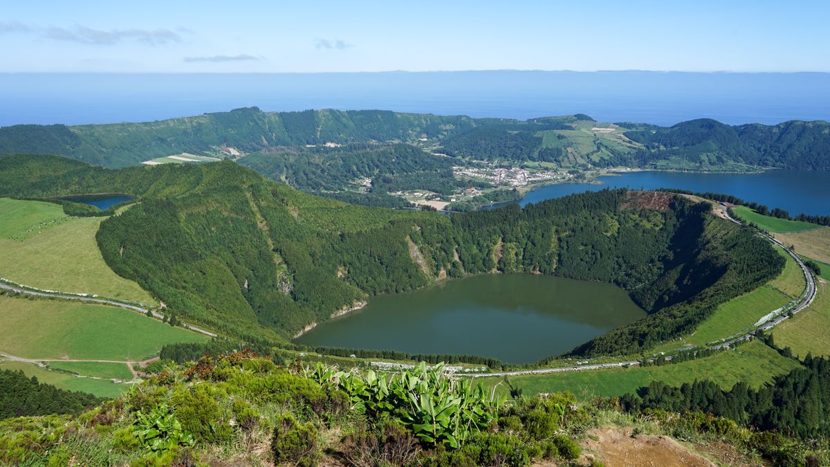 The twin-colored calderas of Sete Cidades — one lake green, one blue, ringed by hydrangeas.