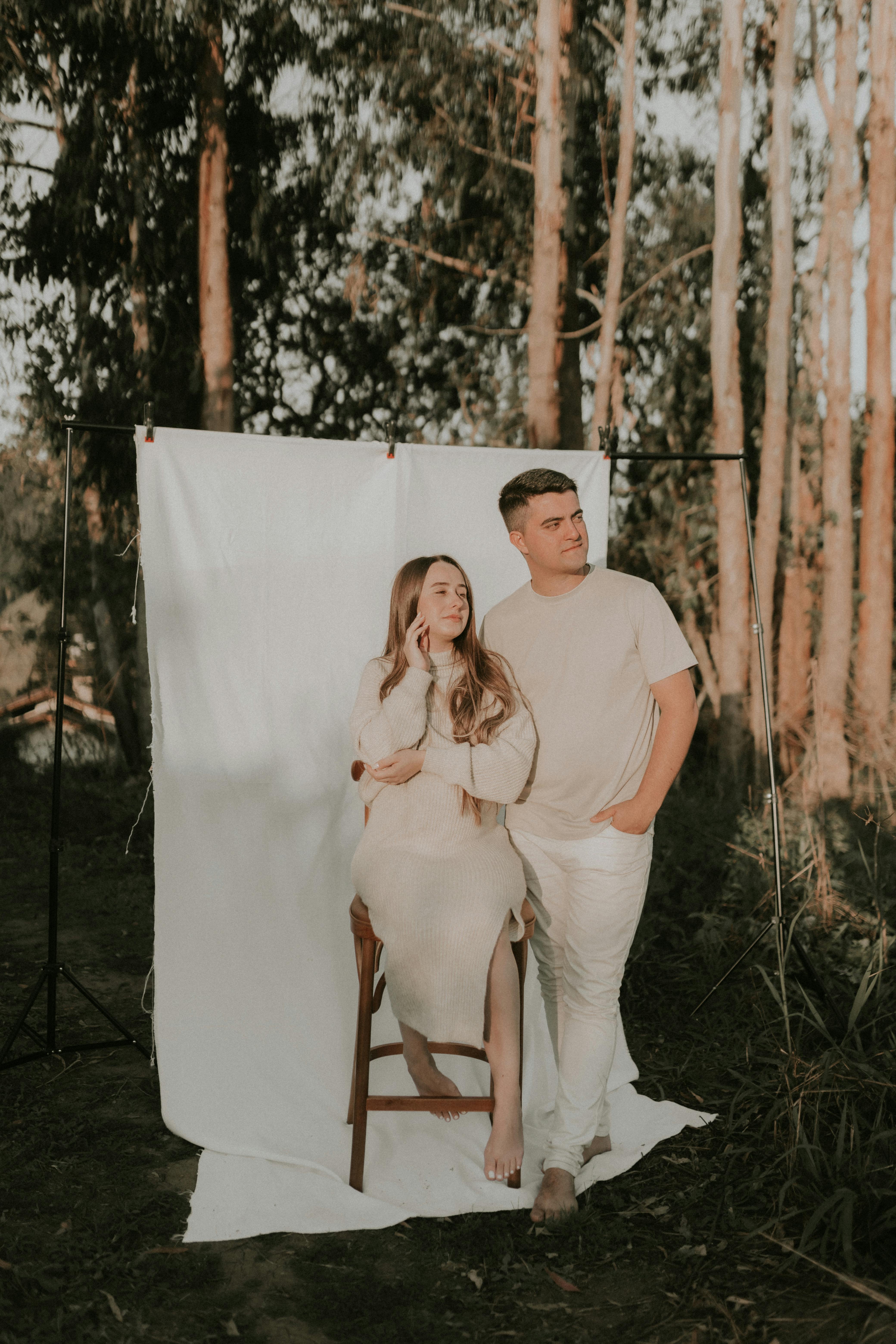 a couple having a photoshoot in a forest