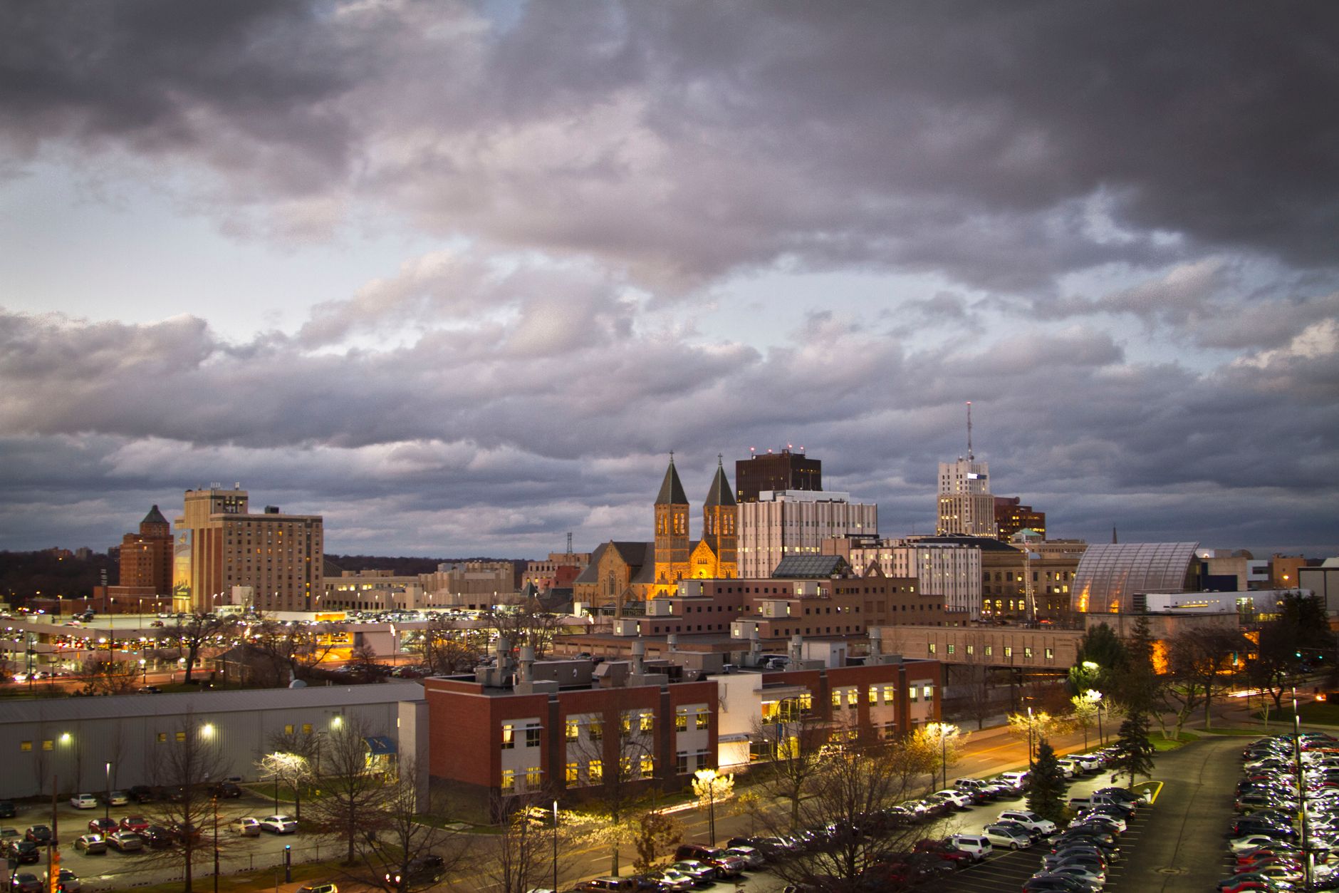 Moody view of downtown Akron, Ohio with an overcast sky during evening.