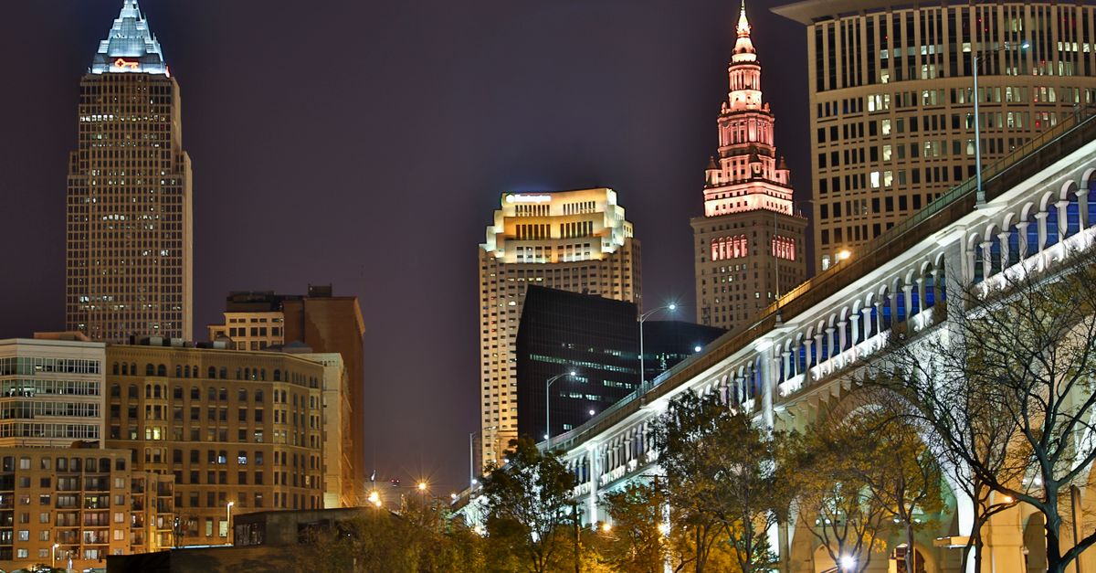 Stunning nighttime view of Cleveland's illuminated skyline and iconic architecture.