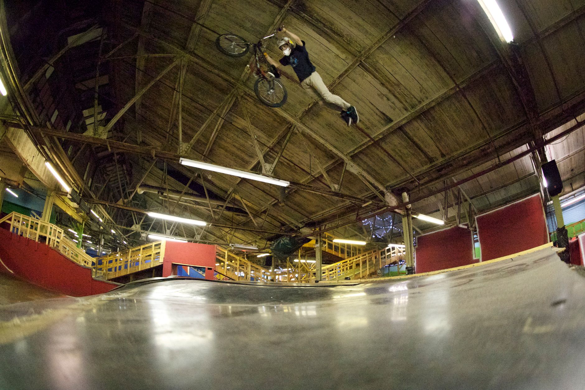 Houston skatepark rider testing a vintage deck after thirty days, sunset shadows across concrete ramps