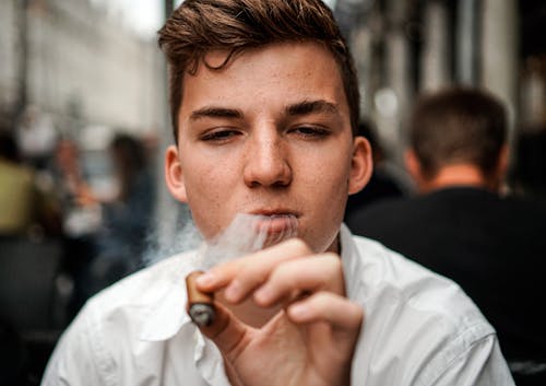 Free Man Smoking Cigar Close-up Photography Stock Photo
