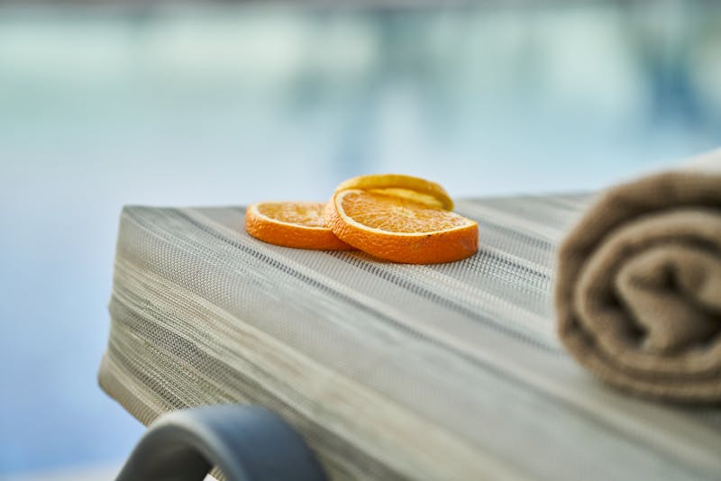 Hands folded in prayer by a window