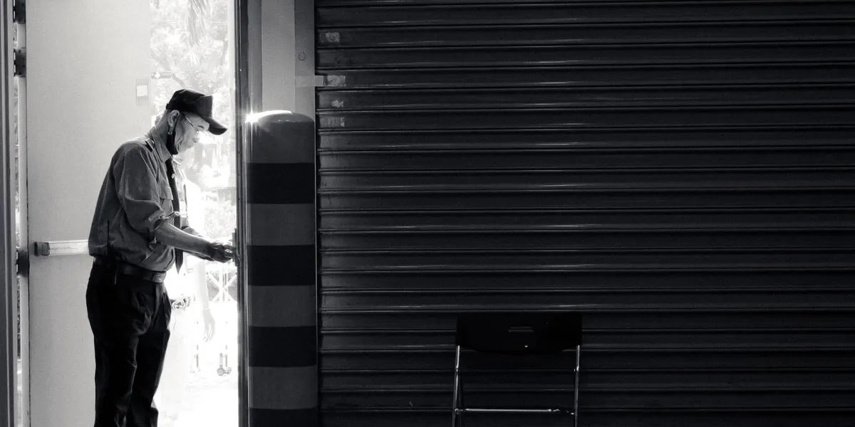 A security guard standing at an open doorway, representing WP Guardian blocking exploit attempts at the entrance to your WordPress site