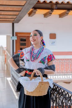 Woman in vibrant Mexican clothing holding basket in Huauchinango, Mexico.