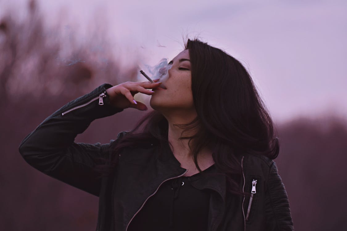 Photo of Woman Smoking Cigarette