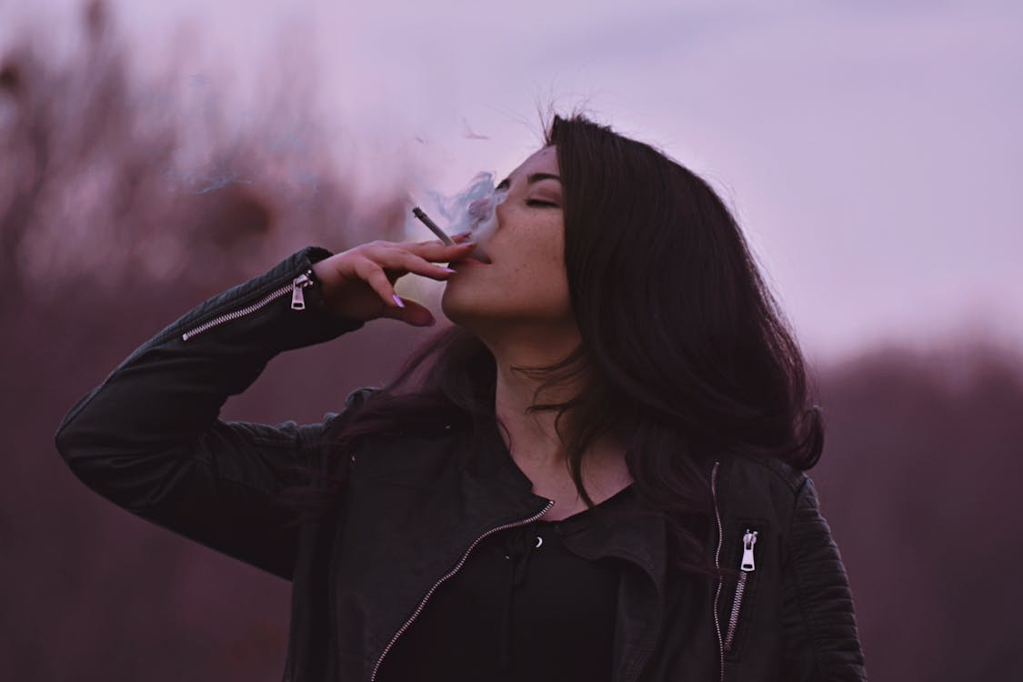 Free Photo of Woman Smoking Cigarette Stock Photo
