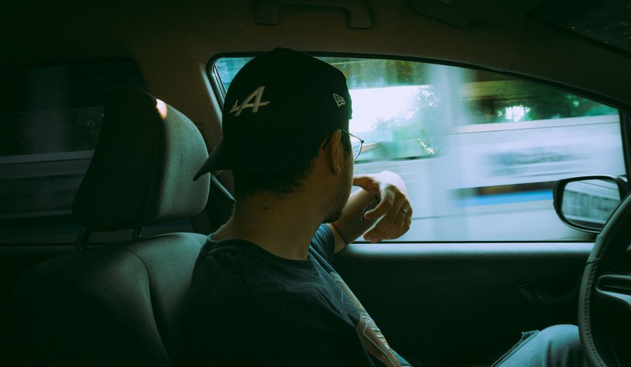 Rear view of a driver at the wheel, photo by Diego Alejandro Lopez on Pexels