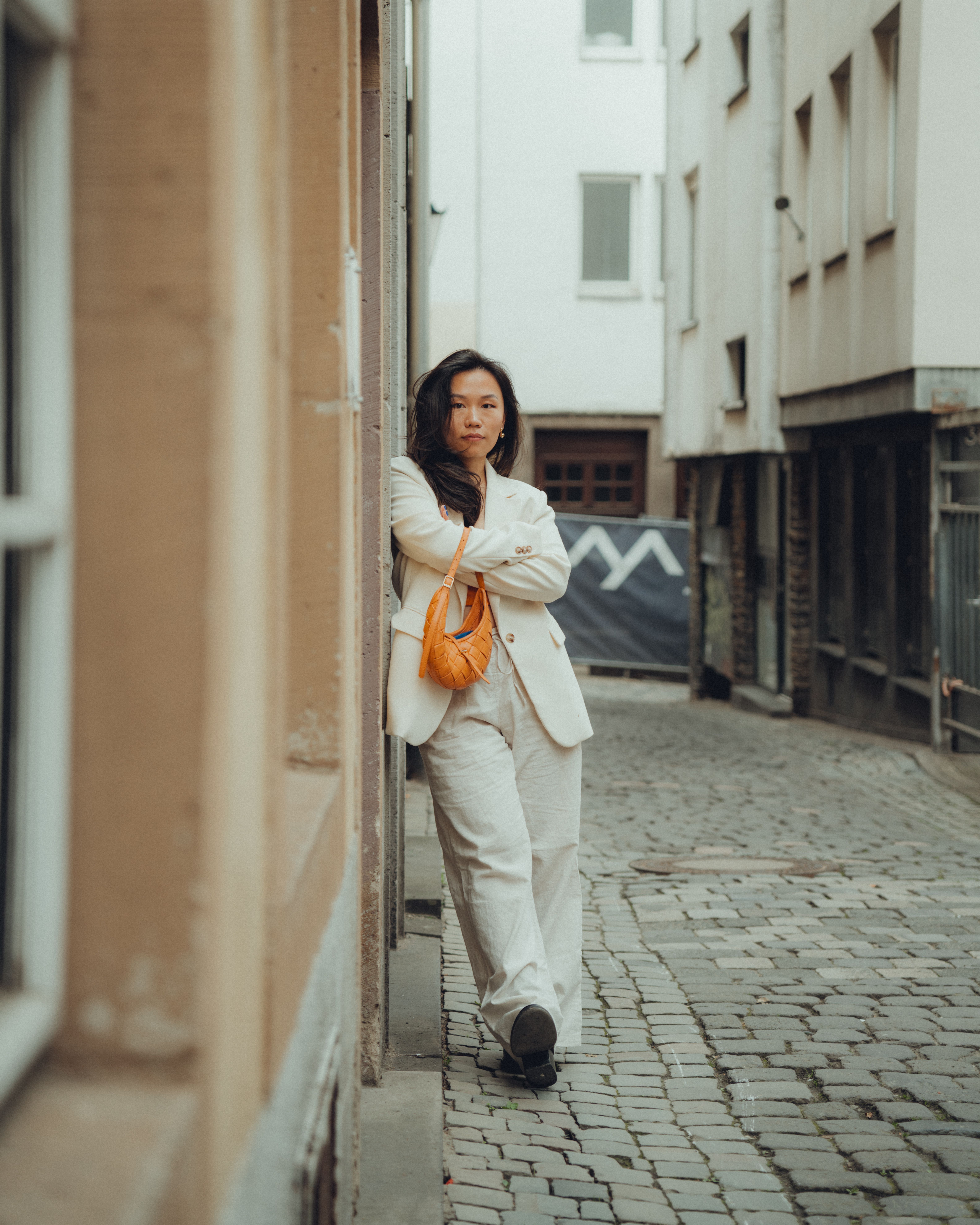 A Fashionable Woman Posing on a Street in a City · Free Stock Photo
