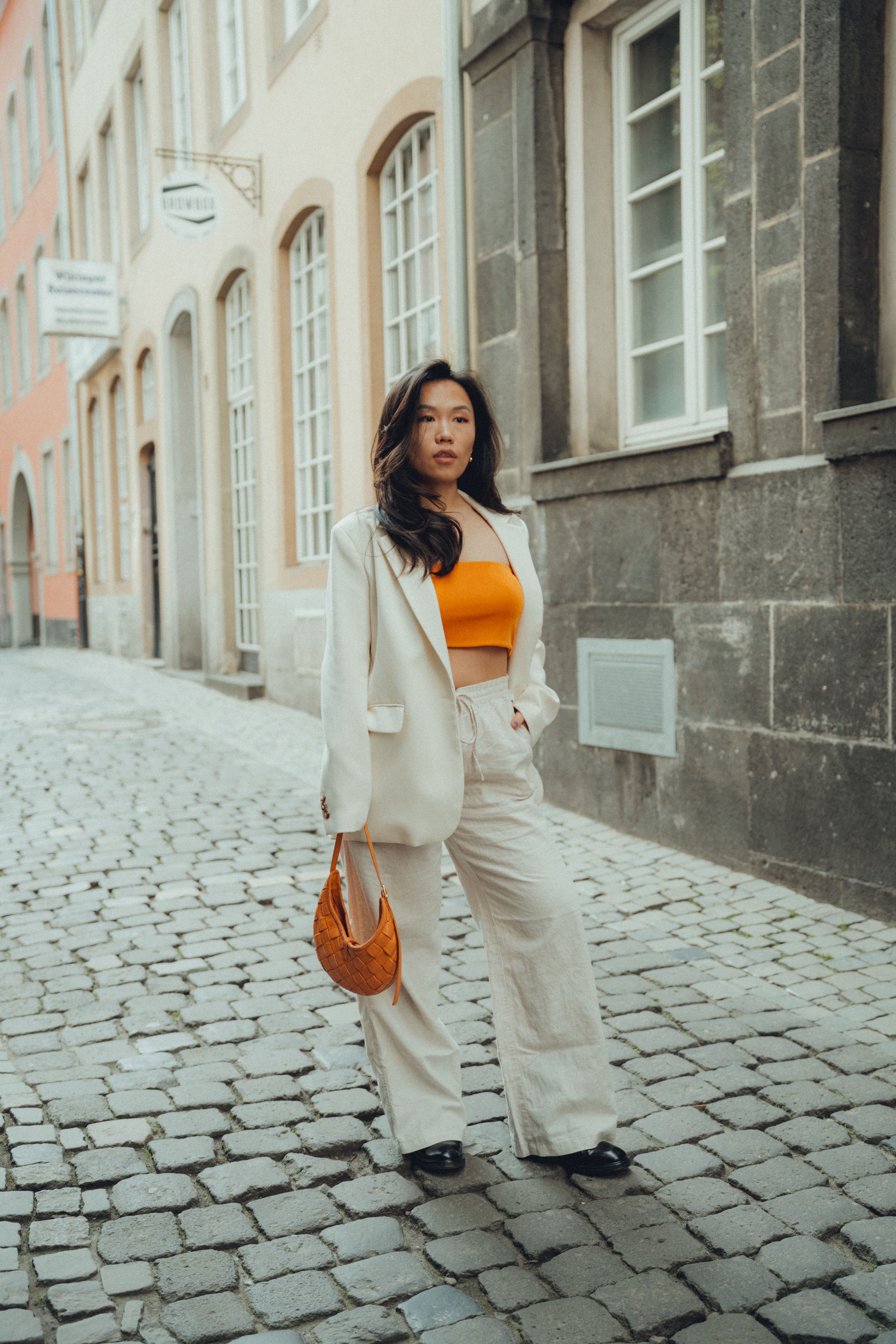 A Fashionable Woman Posing on a Street in a City · Free Stock Photo