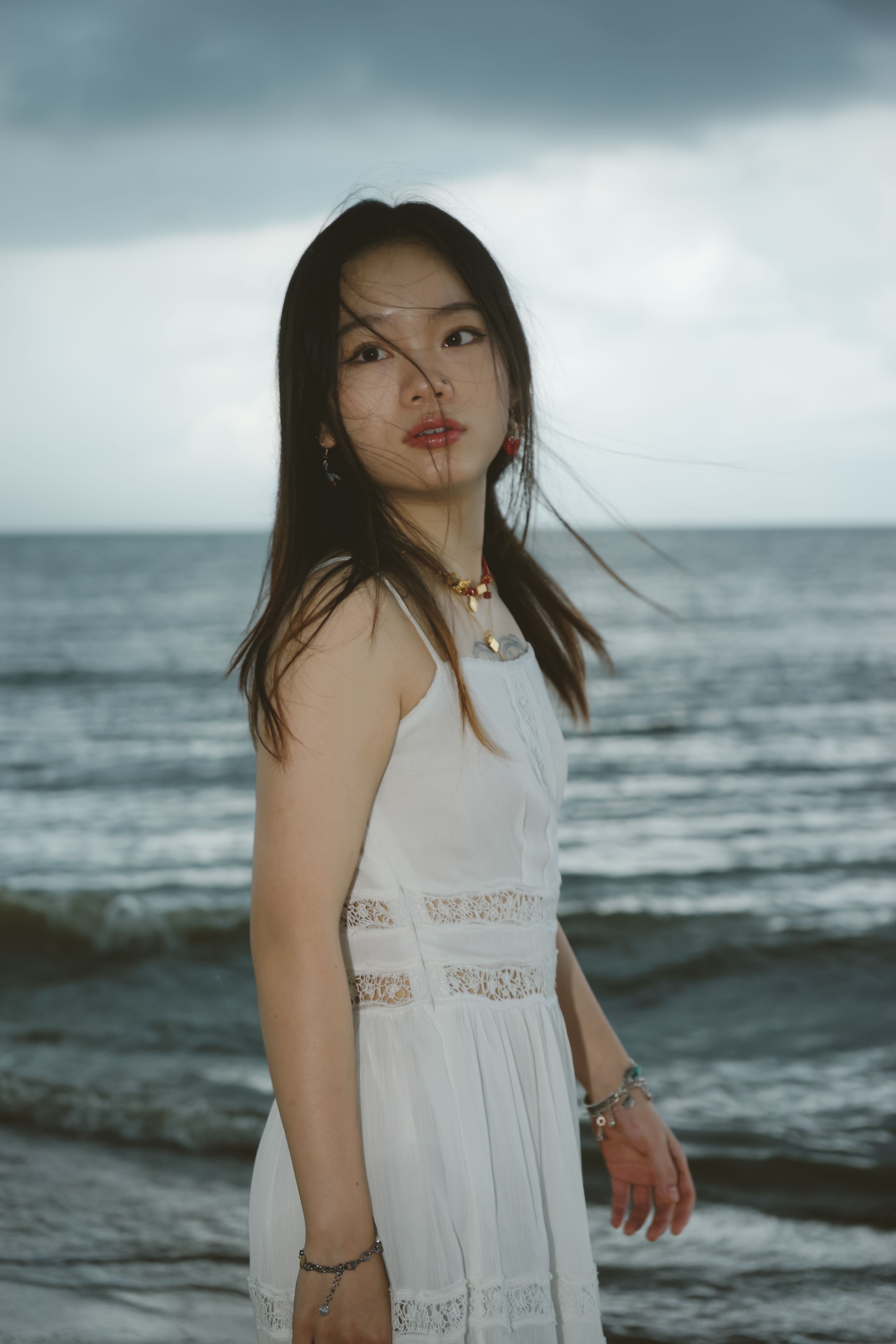 Portrait of Woman Wearing White Dress on a Beach  Free Stock Photo