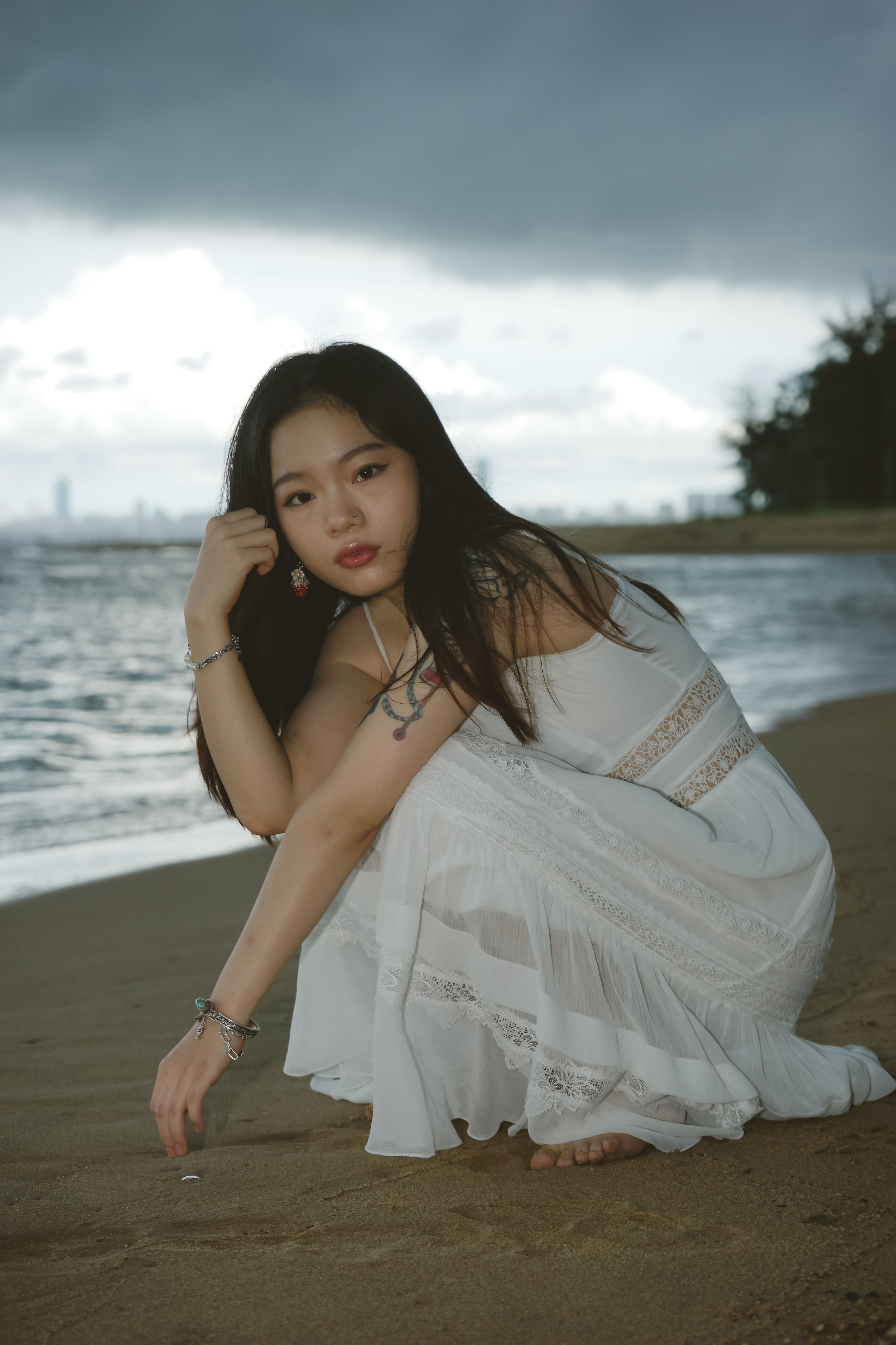 Woman Posing in White Dress on a Beach · Free Stock Photo