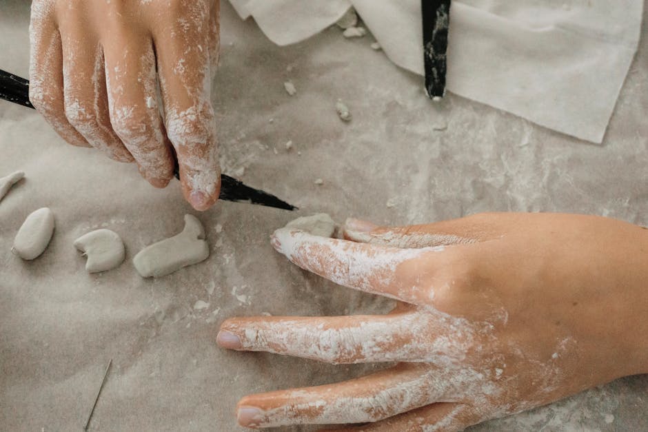 hands sculpting a small clay figure - art therapy activities for self esteem hands sculpting a small clay figure - art therapy activities for self esteem