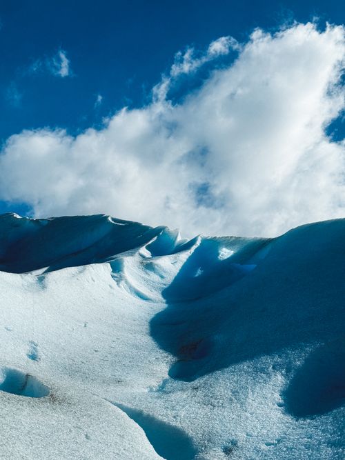 Free Captivating scene of Perito Moreno Glacier under a vibrant blue sky in Santa Cruz, Argentina. Stock Photo
