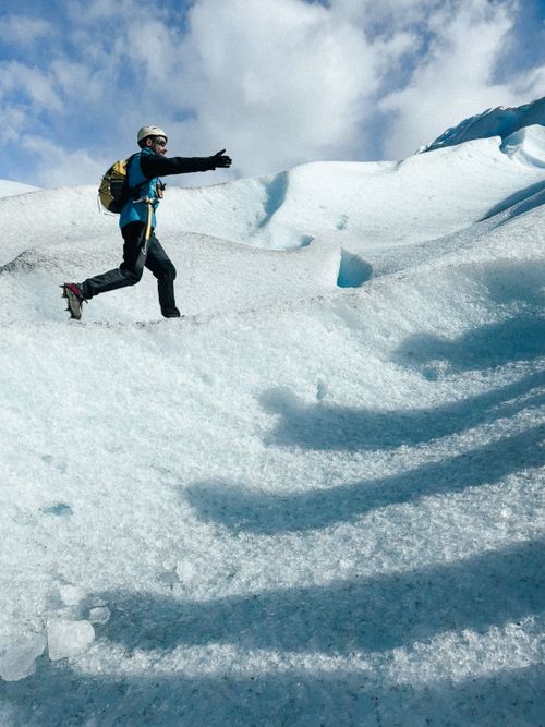 Free A man climbing the icy slopes of Perito Moreno Glacier in Argentina during winter. Stock Photo