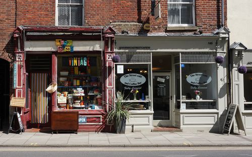 Free Vintage shop and cafe in Norwich showcasing eclectic storefronts and vibrant signage. Stock Photo
