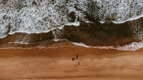 Free Drone view of Ahungalla beach with waves and people on sand, perfect summer vibe. Stock Photo
