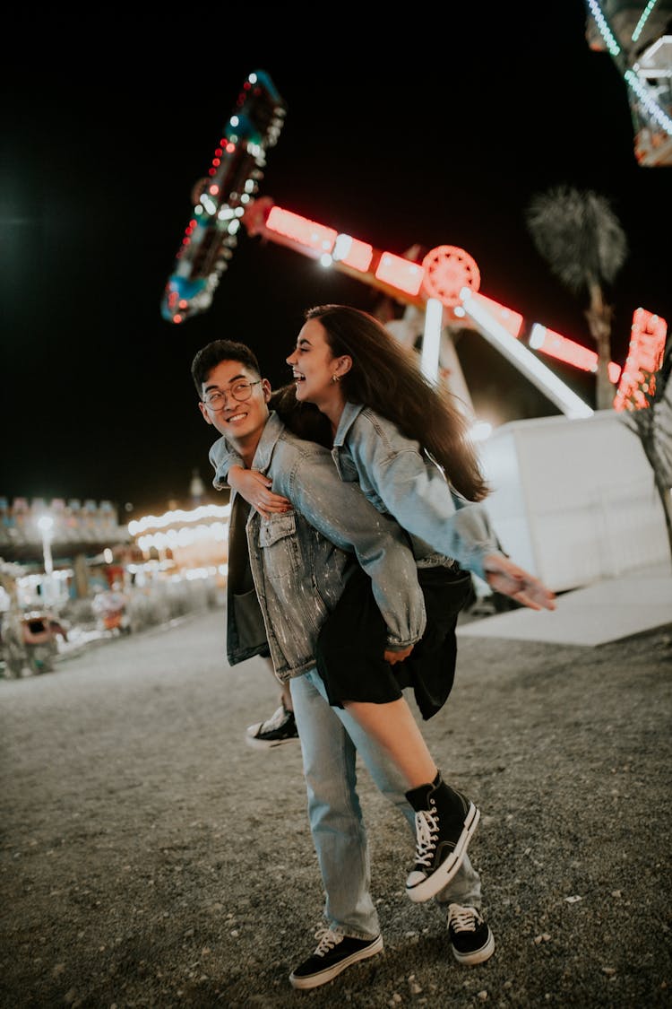 Couple Showing Affection At A Fun Fair