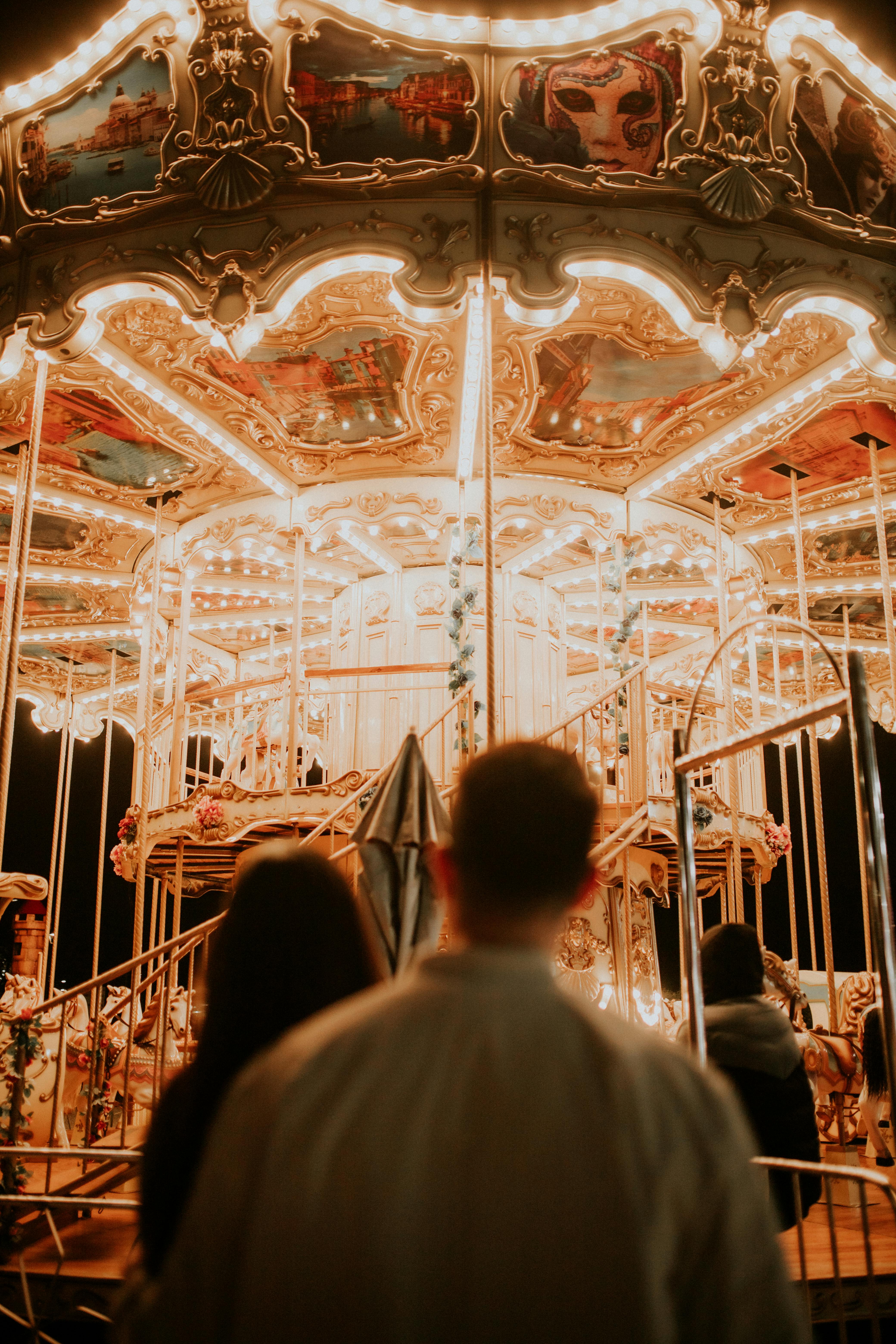 back view of a couple at a fun fair