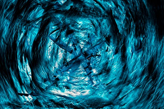 Vibrant abstract artwork in blue hues with dynamic swirling textures and waves.