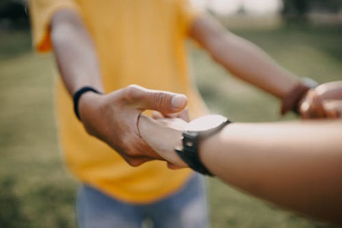 Free Close-Up Photo of Couple Holding Hands Stock Photo