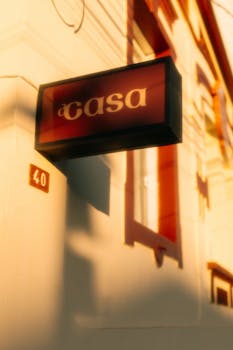 A sunlit urban building featuring a prominent 'Casa' sign and number 40.