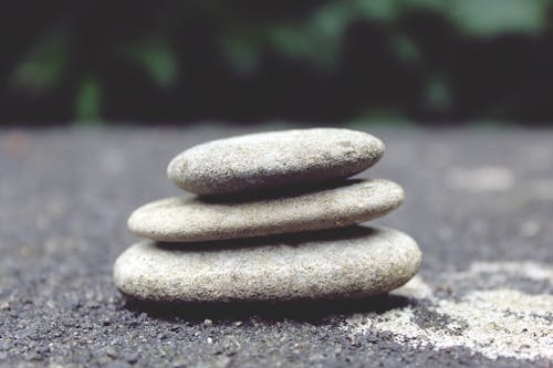 Selective Focus Photography of Cairn Stone