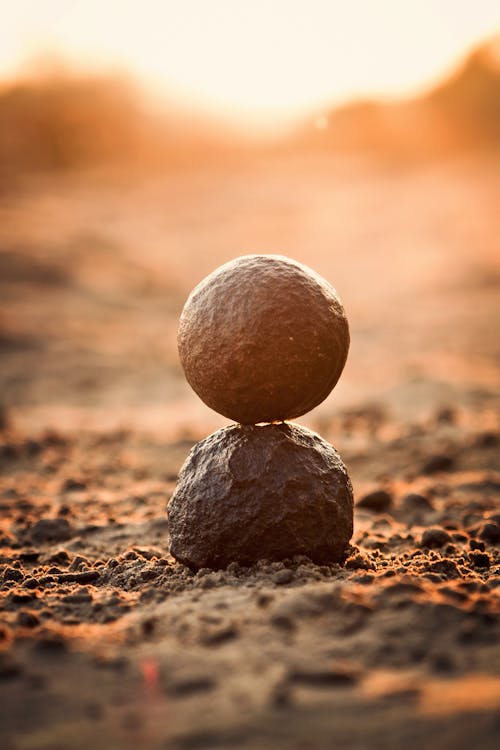 Free Selective Focus Photography of Round Black Rock Stock Photo