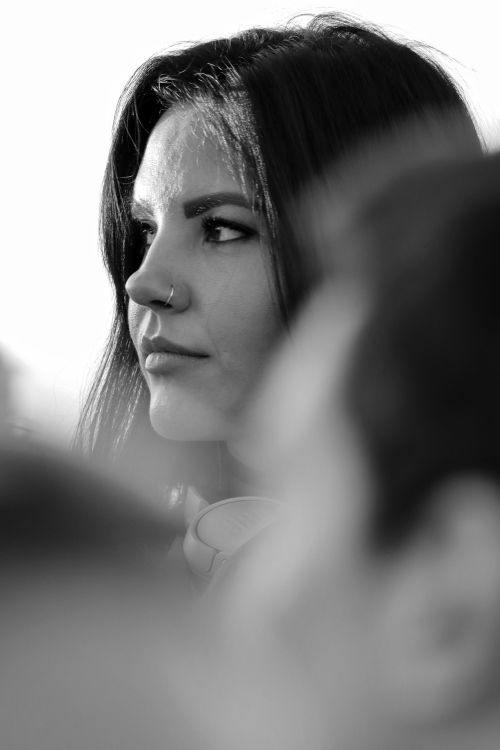 Free Elegant black and white portrait of a woman with a nose piercing, captured in selective focus. Stock Photo