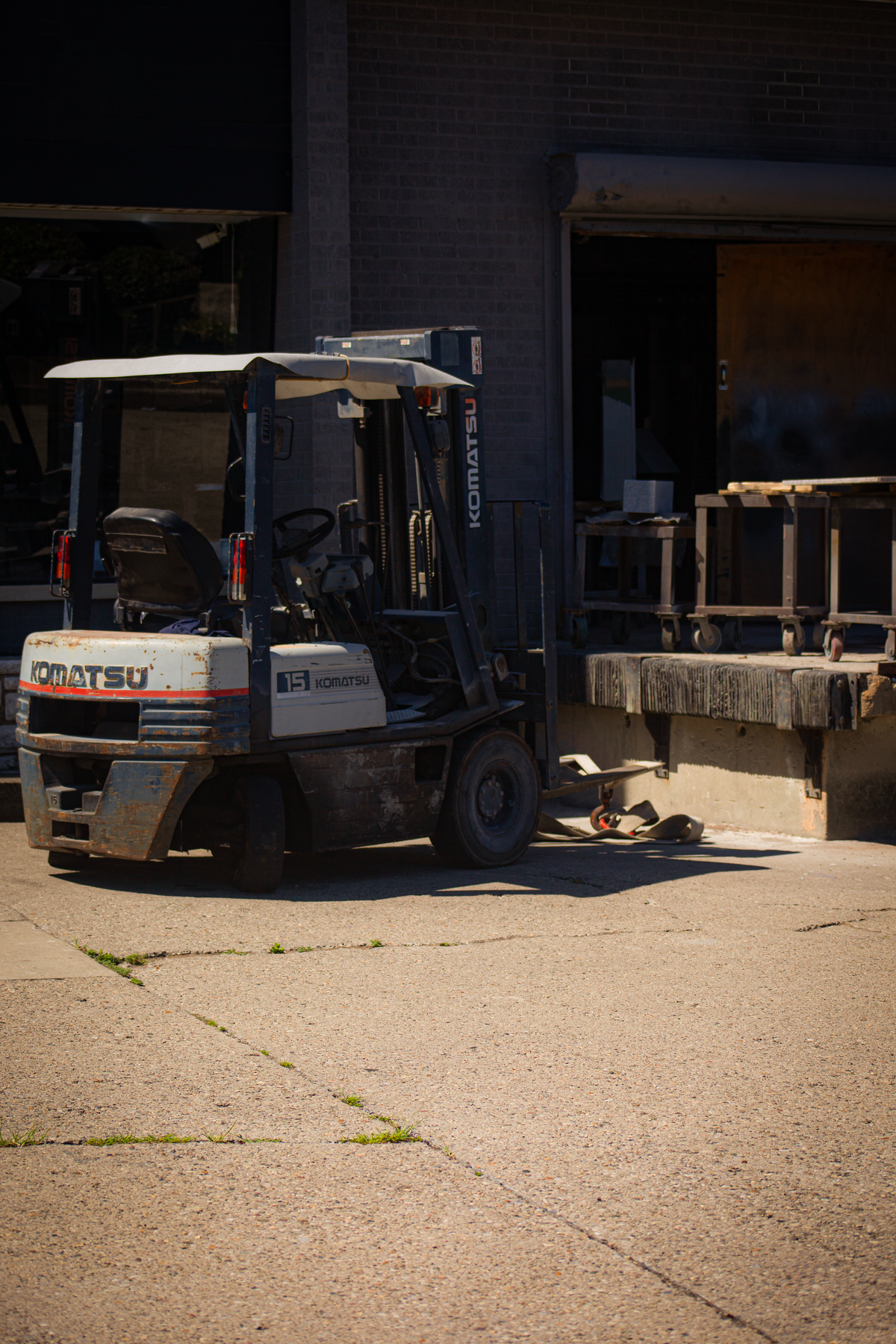 Forklift beside a warehouse loading dock