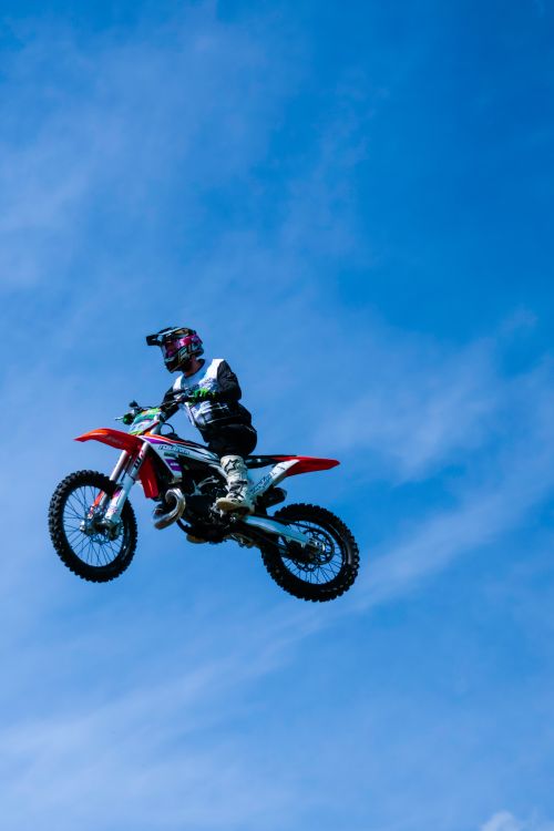 Photo of a Man Jumping a Motorbike Midair · Free Stock Photo