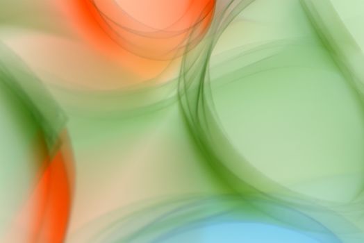 Vibrant abstract art with soft blurred green and orange shapes. Perfect for backgrounds and creative projects.