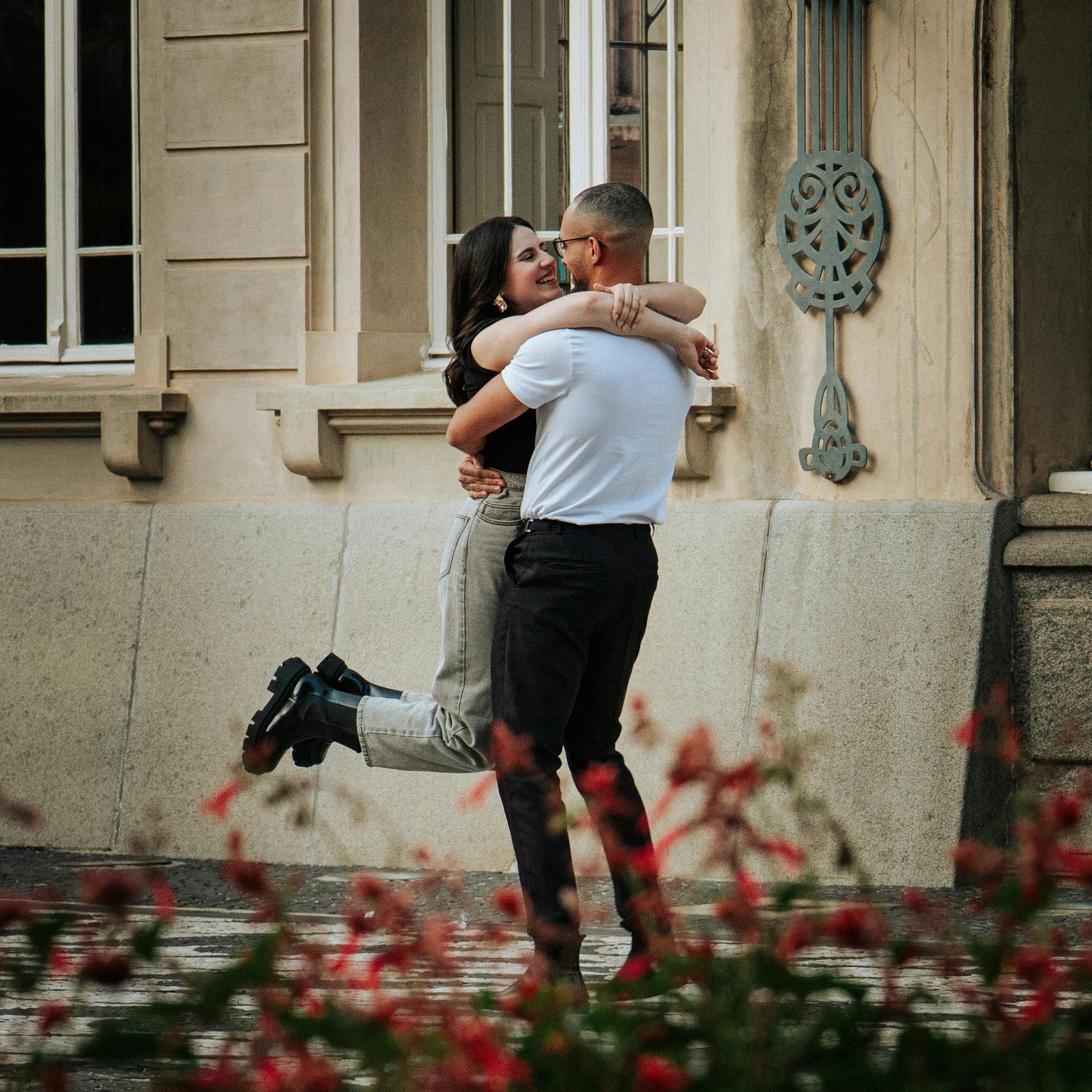 couple hugging on a street