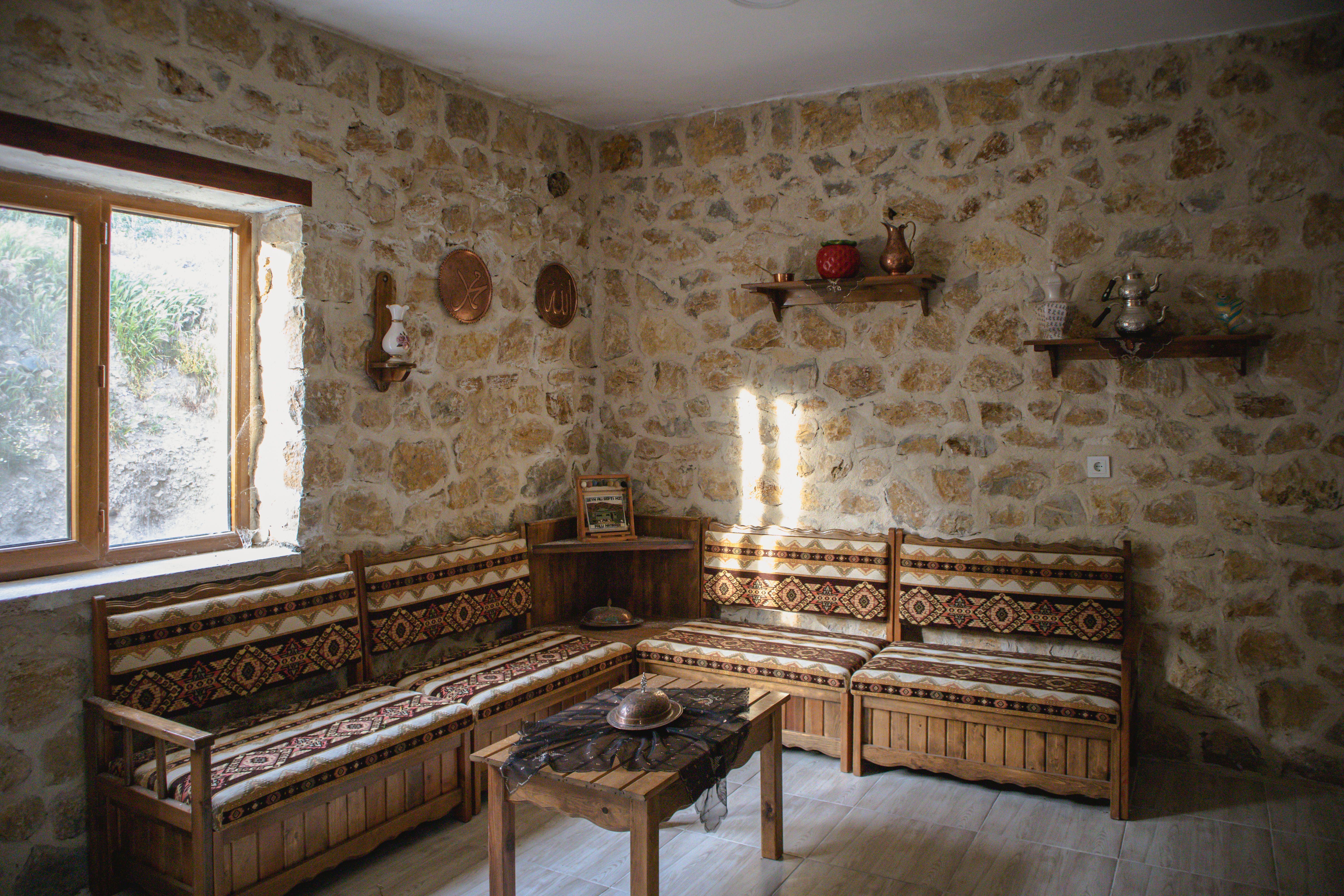 Cozy interior of an authentic Cypriot taverna with traditional decor and wooden tables.