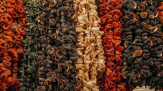 Colorful rows of dried vegetables creating a textured pattern, perfect for culinary backgrounds.